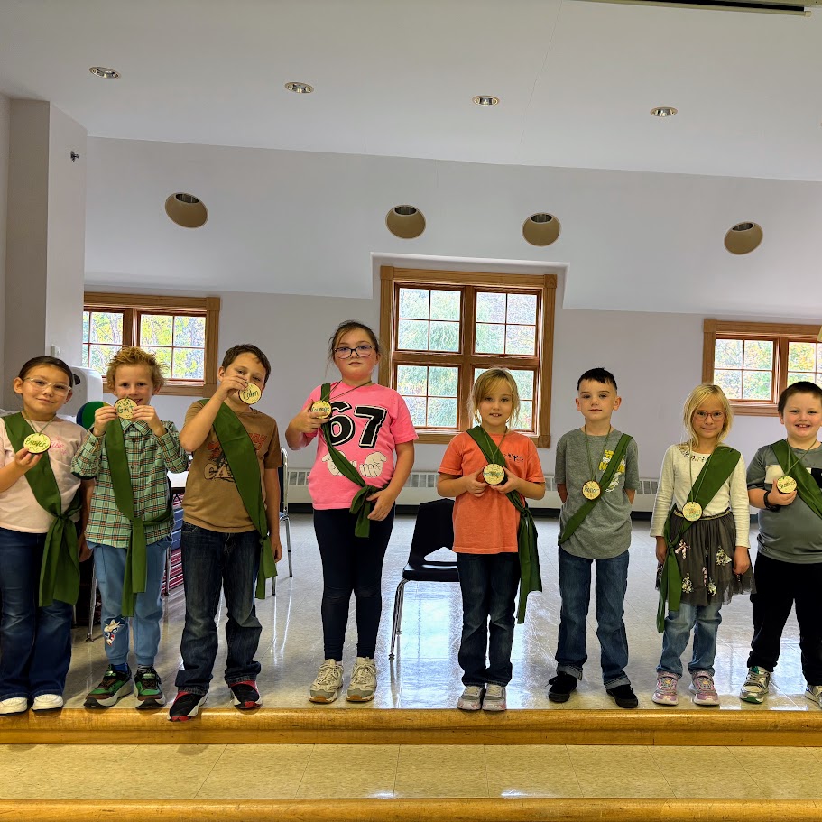 Students receive their olympic medals